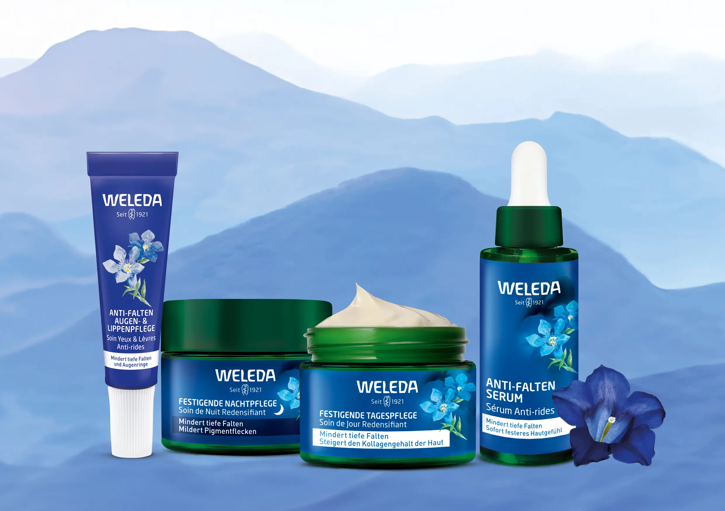 weleda-produkte-packshots-anti-aging-blauer-hintergrund-berge